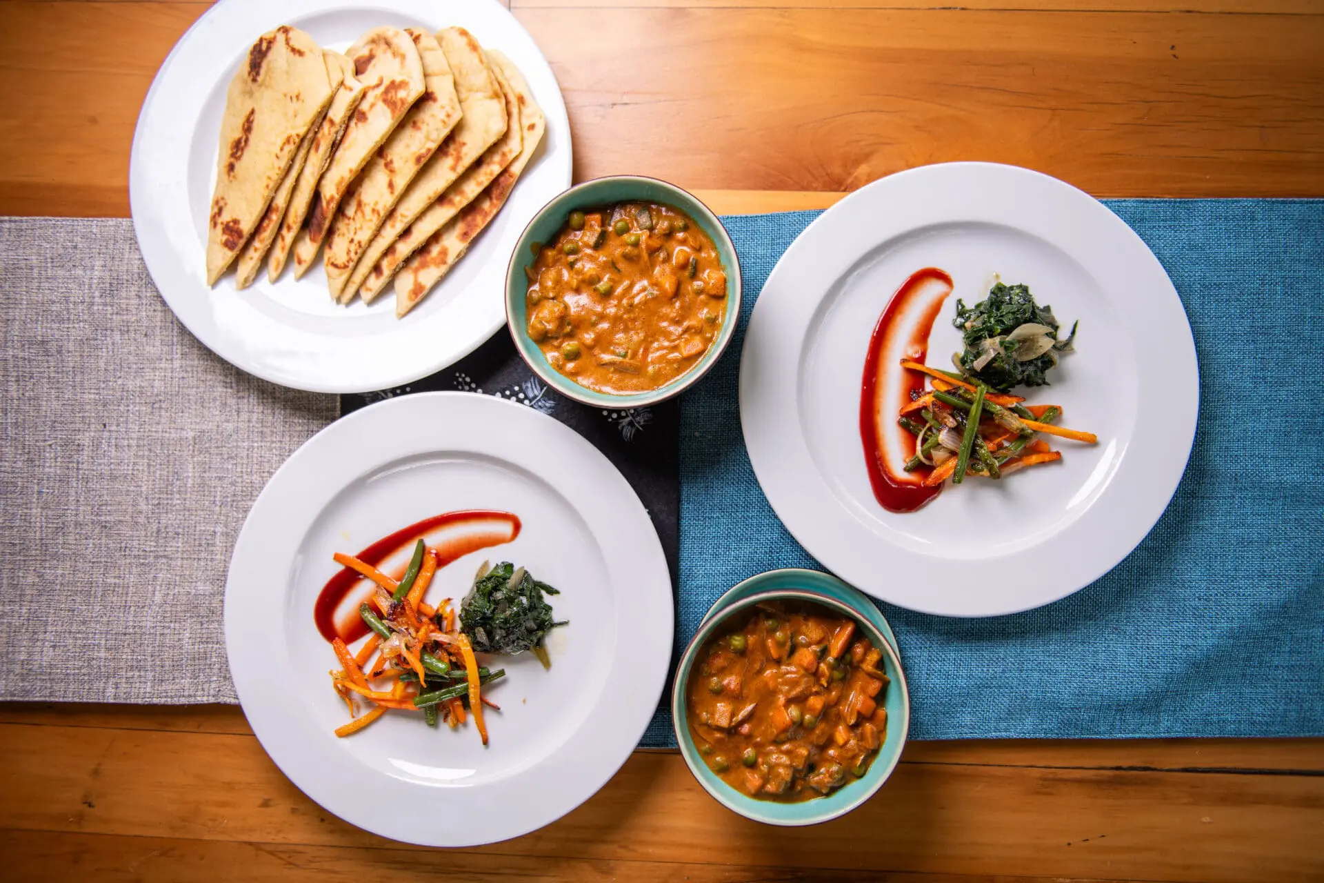 Collection of 4 dinner plates with delicious and nicely arranged food items